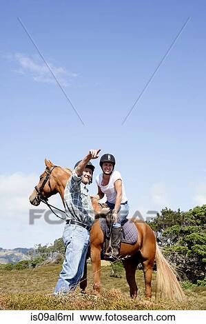 Stock Image - Horse riding, Pakiri Beach, Auckland, New Zealand. Fotosearch