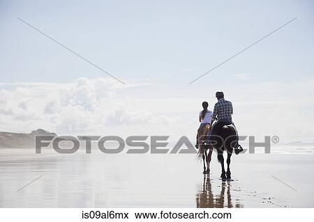 Stock Photo - Horse riding, Pakiri Beach, Auckland, New Zealand. Fotosearch