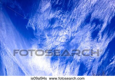 Low angle view of cirrus clouds and blue sky View Large Photo Image Stock Photograph - Low angle view of cirrus clouds and blue sky. Fotosearch