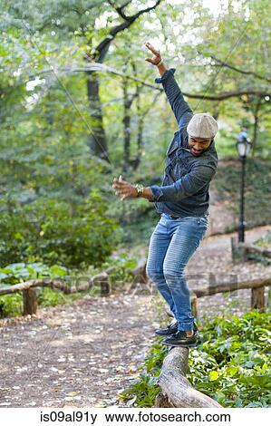 Man balancing on garden edging View Large Photo Image Stock Photo - Man balancing on garden edging. Fotosearch