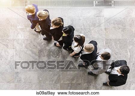 Overhead view of business team in a row View Large Photo Image Stock Photo - Overhead view of business team in a row. Fotosearch
