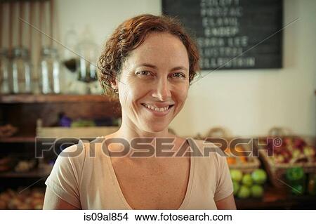Portrait of female shop assistant in country store View Large Photo Image Picture - Portrait of female shop assistant in country store. Fotosearch
