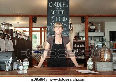 Portrait of female shop assistant in country store cafe View Large Photo Image Stock Photo - Portrait of female shop assistant in country store cafe. Fotosearch