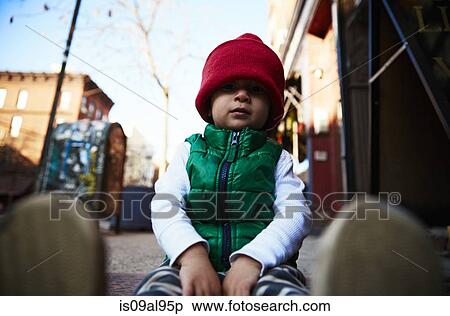 Portrait of male toddler sitting on street sidewalk View Large Photo Image Stock Photography - Portrait of male toddler sitting on street sidewalk. Fotosearch