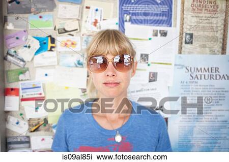 Portrait of mid adult woman in front of community notice board View Large Photo Image Stock Image - Portrait of mid adult woman in front of community notice board. Fotosearch