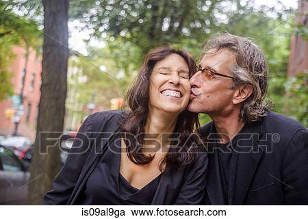 Portrait of romantic mature couple on city street View Large Photo Image Stock Image - Portrait of romantic mature couple on city street. Fotosearch