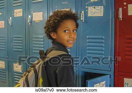 Portrait of schoolgirl opening school locker View Large Photo Image Stock Image - Portrait of schoolgirl opening school locker. Fotosearch