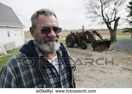 Portrait of senior male farmer in farmyard, Plattsburg, Missouri, USA View Large Photo Image Stock Image - Portrait of senior male farmer in farmyard, Plattsburg, Missouri, USA. Fotosearch