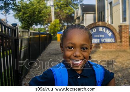 Portrait of smiling schoolboy at school gate View Large Photo Image Stock Photograph - Portrait of smiling schoolboy at school gate. Fotosearch