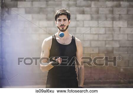 Portrait of young male handball player throwing ball View Large Photo Image Stock Photograph - Portrait of young male handball player throwing ball. Fotosearch