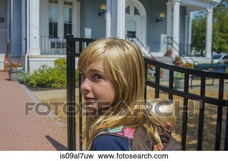 Schoolgirl and younger brother at school gate View Large Photo Image Stock Photo - Schoolgirl and younger brother at school gate. Fotosearch