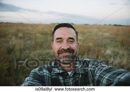 Self portrait of smiling farmer in field, Plattsburg, Missouri, USA View Large Photo Image Stock Image - Self portrait of smiling farmer in field, Plattsburg, Missouri, USA. Fotosearch