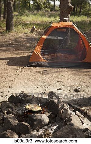 Stir fry on campfire and tent, Indiahoma, Oklahoma, USA View Large Photo Image Stock Image - Stir fry on campfire and tent, Indiahoma, Oklahoma, USA. Fotosearch