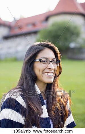 Student wearing glasses, smiling View Large Photo Image Stock Image - Student wearing glasses, smiling. Fotosearch