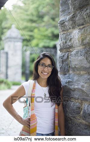 Student wearing glasses, smiling View Large Photo Image Stock Image - Student wearing glasses, smiling. Fotosearch