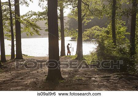 Teenage boy fishing at forest lake, Arkansas, USA View Large Photo Image Stock Photograph - Teenage boy fishing at forest lake, Arkansas, USA. Fotosearch