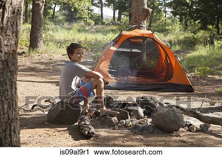 Teenage boy preparing campfire, Indiahoma, Oklahoma, USA View Large Photo Image Stock Image - Teenage boy preparing campfire, Indiahoma, Oklahoma, USA. Fotosearch