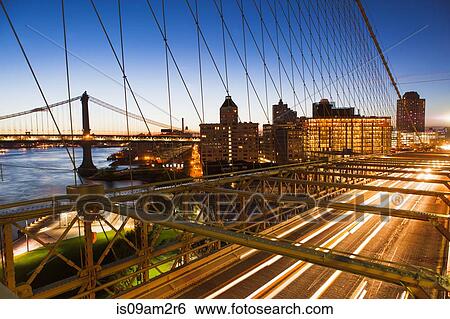 Stock Photograph - Traffic on Brooklyn Bridge at night, Manhattan, New York, USA. Fotosearch