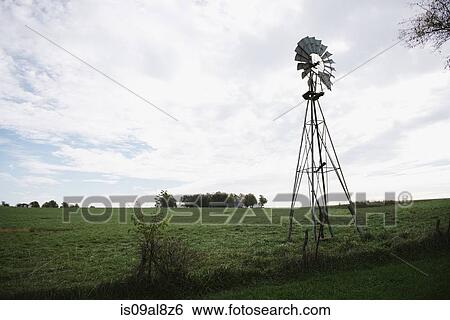 Windmill on field hillside, Missouri, USA View Large Photo Image Stock Photograph - Windmill on field hillside, Missouri, USA. Fotosearch