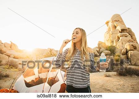 Woman getting ready to bed down in tent, Joshua Tree National Park, California, US View Large Photo Image Stock Photo - Woman getting ready to bed down in tent, Joshua Tree National Park, California, US. Fotosearch