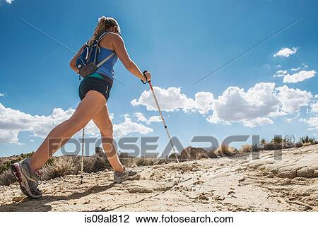 Stock Image - Woman hiking, Joshua Tree National Park, California, US. Fotosearch