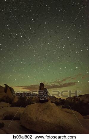 Woman, starry night, Joshua Tree National Park, California, US View Large Photo Image Stock Image - Woman, starry night, Joshua Tree National Park, California, US. Fotosearch