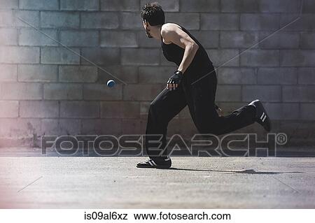 Young male handball player running for ball View Large Photo Image Stock Photo - Young male handball player running for ball. Fotosearch