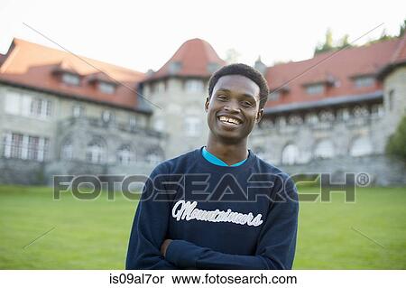 Stock Photography - Young man wearing sweatshirt, portrait. Fotosearch