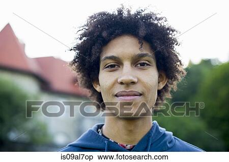 Stock Photography - Young man with afro, portrait. Fotosearch