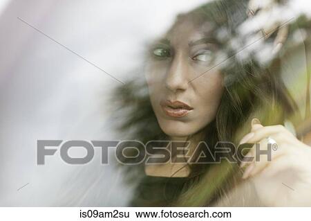 Young woman in car View Large Photo Image Stock Photograph - Young woman in car. Fotosearch