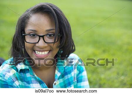 Picture - Young woman wearing glasses, portrait. Fotosearch