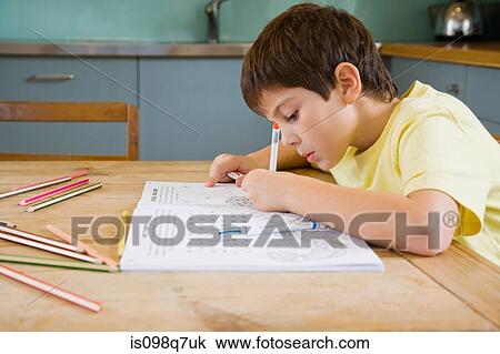 A boy colouring in View Large Photo Image Stock Image - A boy colouring in. Fotosearch