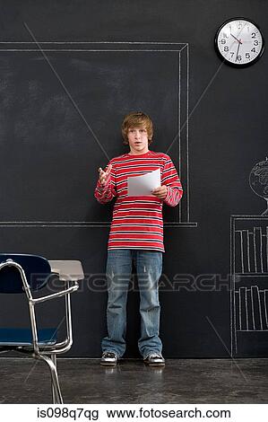 A boy giving a presentation View Large Photo Image Stock Image - A boy giving a presentation. Fotosearch