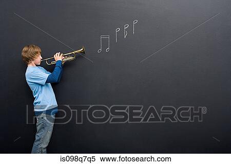 A boy playing the trumpet View Large Photo Image Stock Photography - A boy playing the trumpet. Fotosearch