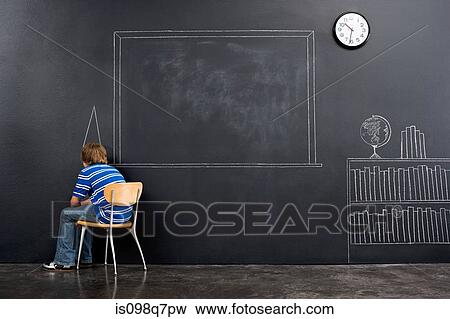 A boy sat in a corner with a chalk dunce cap View Large Photo Image Stock Photo - A boy sat in a corner with a chalk dunce cap. Fotosearch