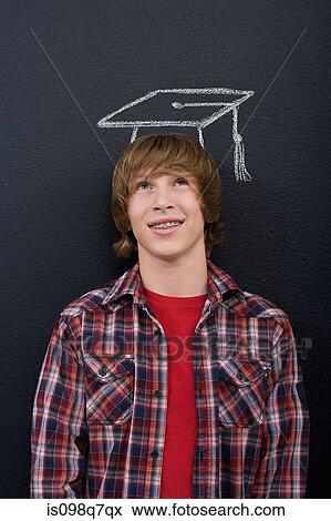 Stock Photo - A boy with a chalk mortar board. Fotosearch