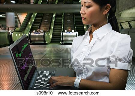 A commuter using a laptop View Large Photo Image Stock Image - A commuter using a laptop. Fotosearch