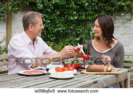 A couple dining al fresco View Large Photo Image Stock Photo - A couple dining al fresco. Fotosearch