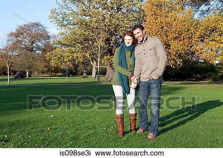 A couple holding hands in dulwich park View Large Photo Image Stock Image - A couple holding hands in dulwich park. Fotosearch