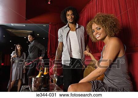 A couple in a vip area of a nightclub View Large Photo Image Stock Image - A couple in a vip area of a nightclub. Fotosearch