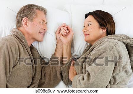 A couple in bed View Large Photo Image Stock Photo - A couple in bed. Fotosearch