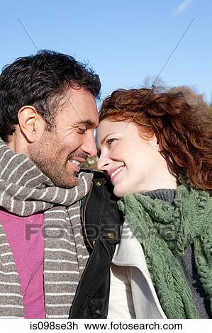 Stock Image - A couple smiling face to face. Fotosearch