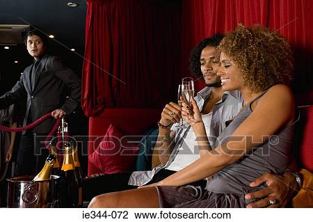 A couple toasting with champagne View Large Photo Image Stock Image - A couple toasting with champagne. Fotosearch