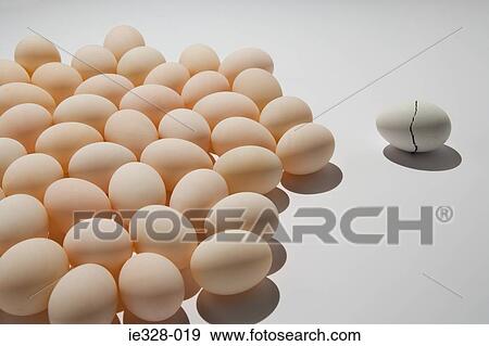 A cracked egg near other eggs View Large Photo Image Stock Photo - A cracked egg near other eggs. Fotosearch