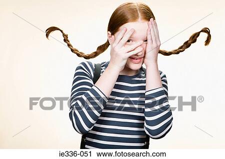 A girl looking through her fingers View Large Photo Image Stock Image - A girl looking through her fingers. Fotosearch