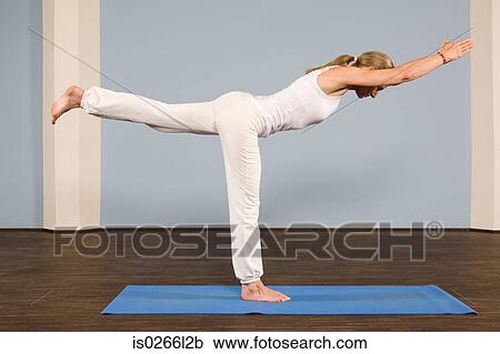 A mature woman in a yoga position View Large Photo Image Stock Image - A mature woman in a yoga position. Fotosearch