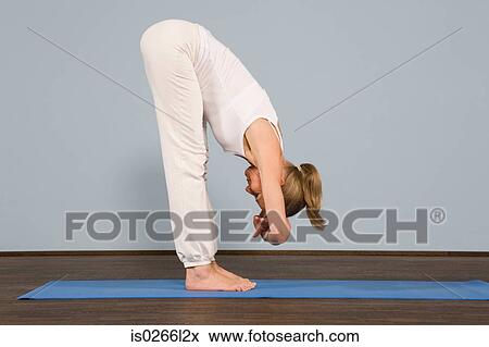 A mature woman in a yoga position View Large Photo Image Stock Photo - A mature woman in a yoga position. Fotosearch
