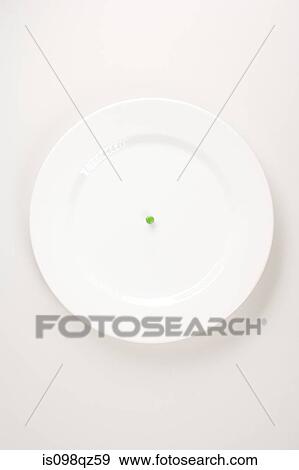 Stock Photo - A pea on a plate. Fotosearch