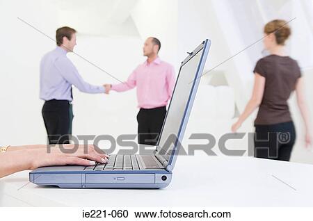 A person typing on a laptop View Large Photo Image Stock Image - A person typing on a laptop. Fotosearch