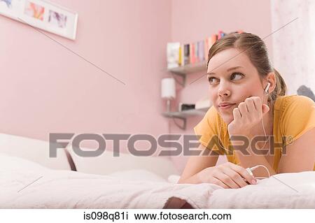 A teenage girl listening to music View Large Photo Image Stock Image - A teenage girl listening to music. Fotosearch